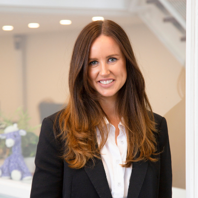 Alice Fulton-Sherriff marketing consultant at Purple Giraffe marketing consultant company smiling at the camera working at desk professional marketing consultants