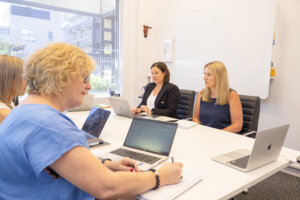 Purple Giraffe team having a meeting in a boardroom