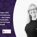 Lynda, our founder, holding a glass of wine in celebration of the Wine Communicator Awards 2025